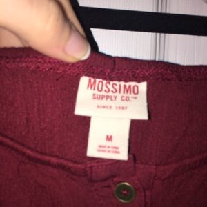 A burgundy off the shoulder button down dress